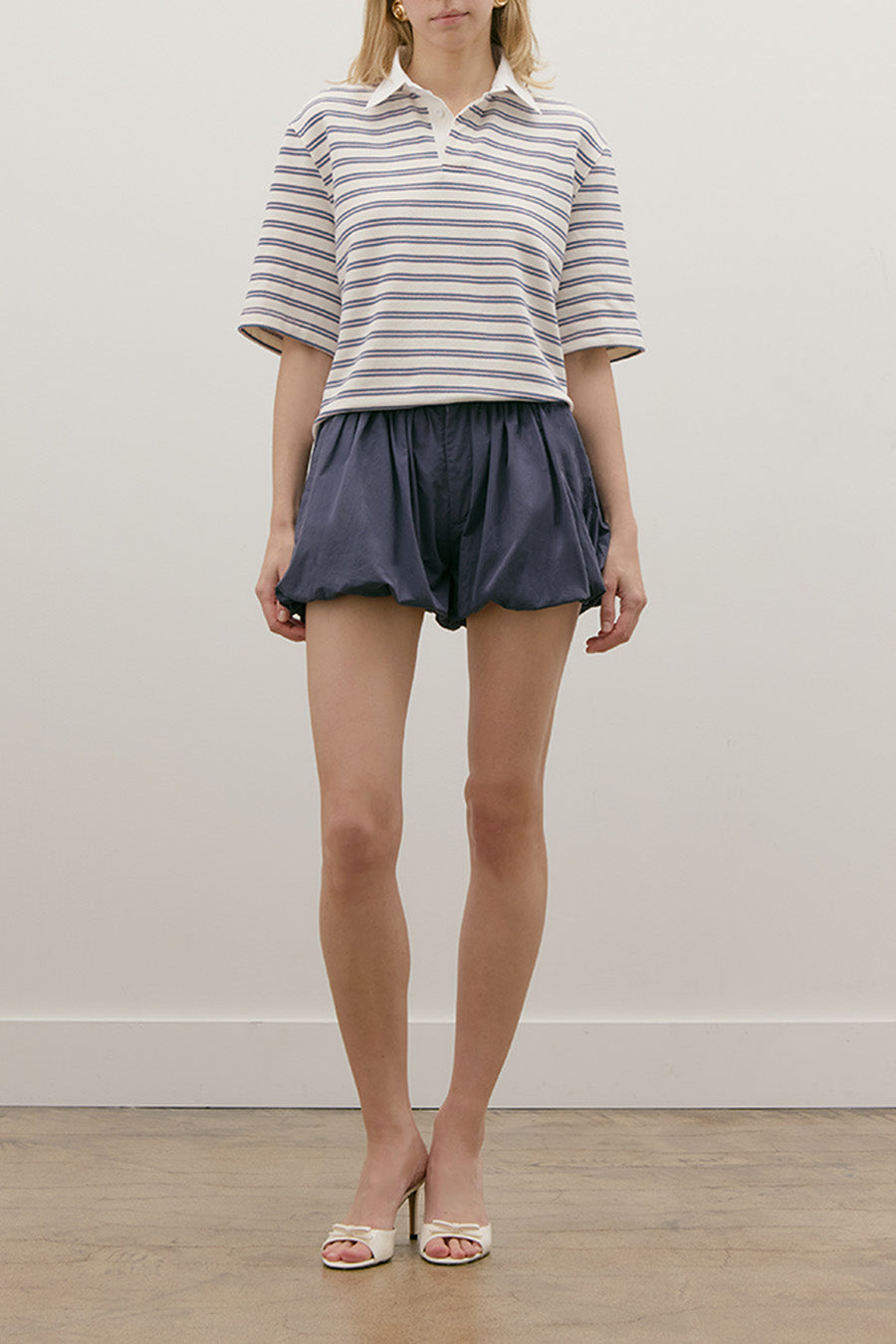 A timeless essential elevated through refined craftsmanship, this striped top embodies understated luxury.