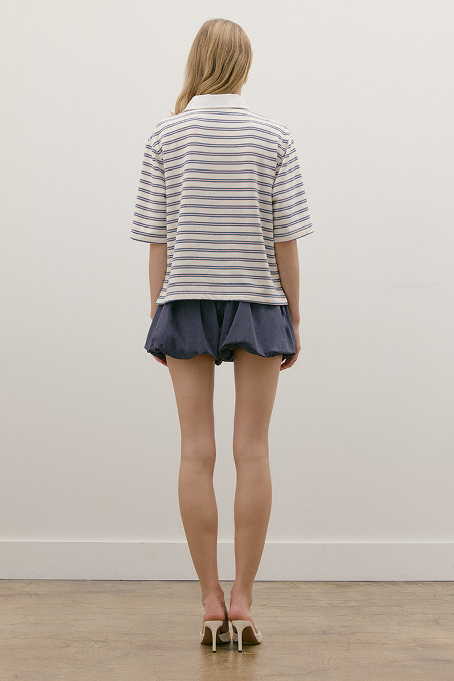 The clean silhouette and impeccable finish make it a versatile foundation piece—perfect for layering or wearing on its own