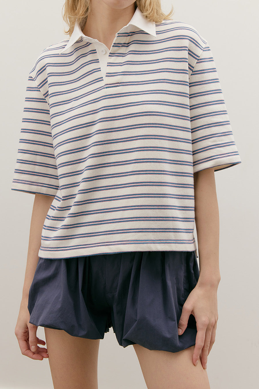 Designed to move seamlessly between seasons, these top balances comfort with polish, making it an essential for a thoughtfully curated wardrobe.