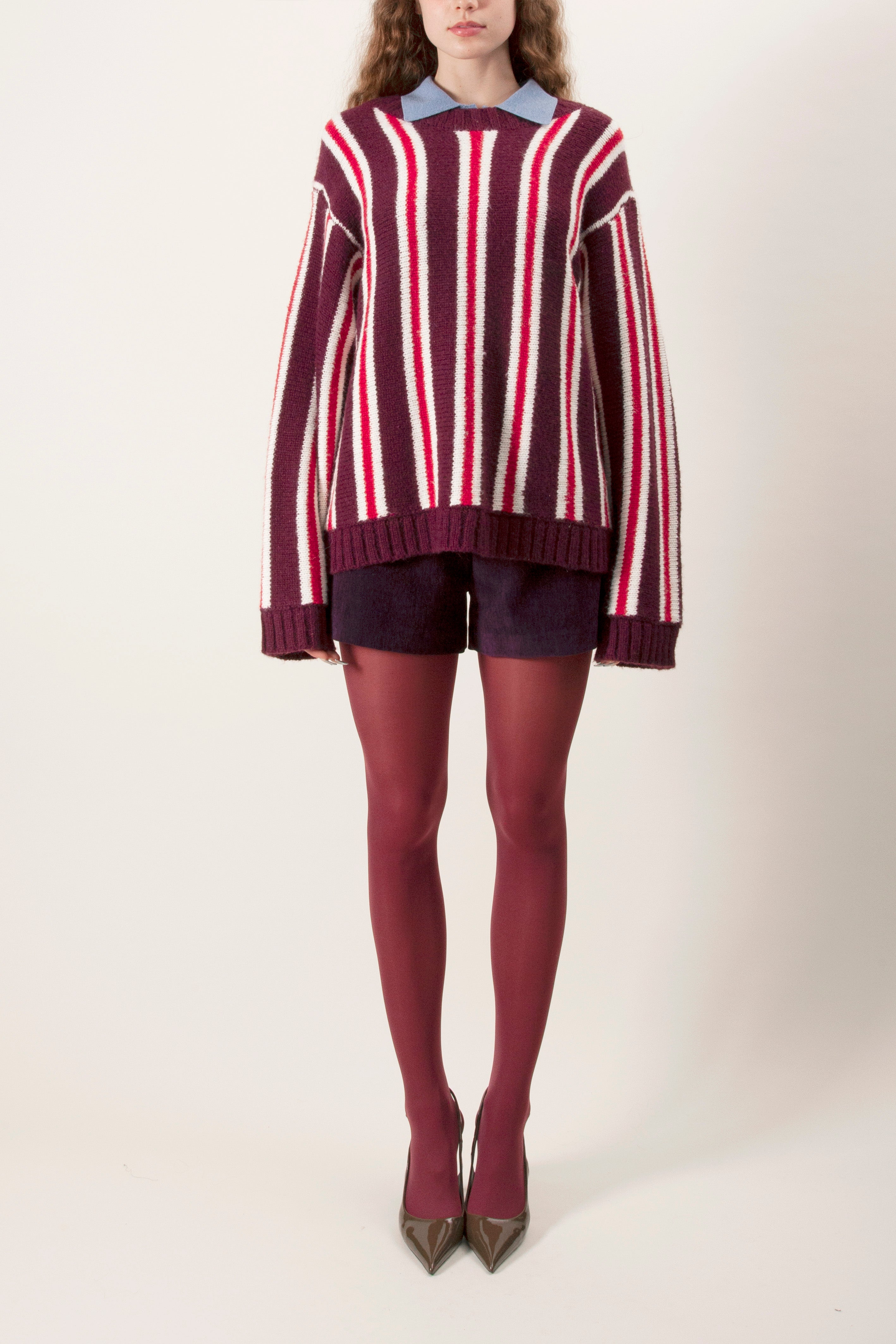 Add color and texture to your cold-weather wardrobe with this striped knit sweater, designed for effortless layering and everyday comfort.