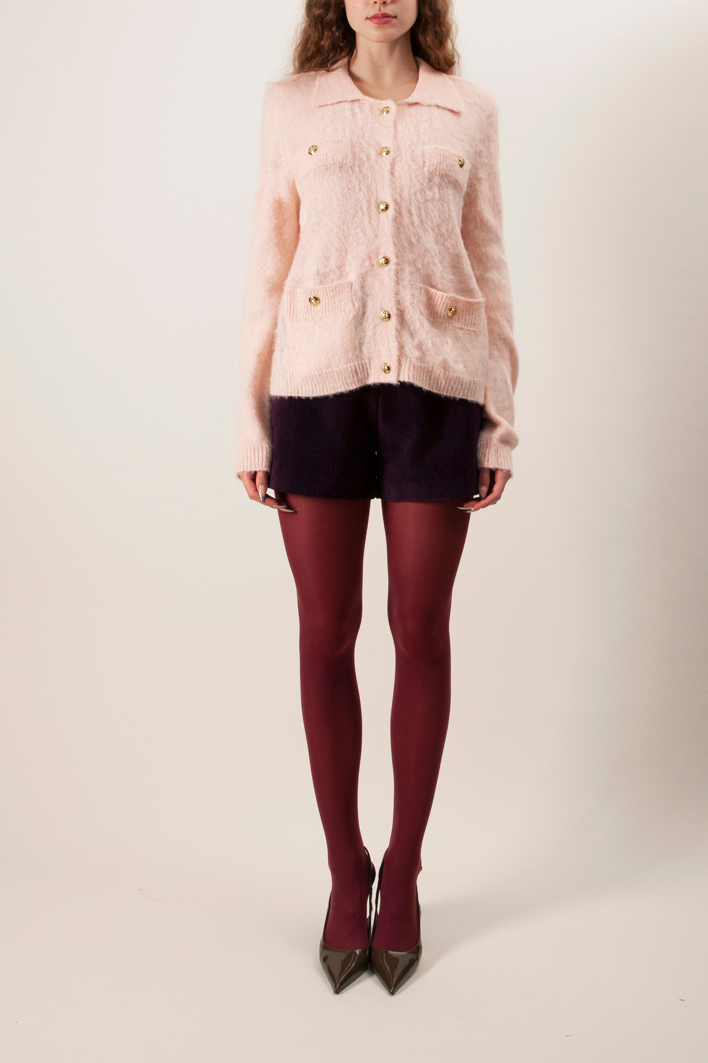 Elegant and effortlessly cozy, this button-front knit cardigan is a timeless layering piece designed with a polished, feminine touch.