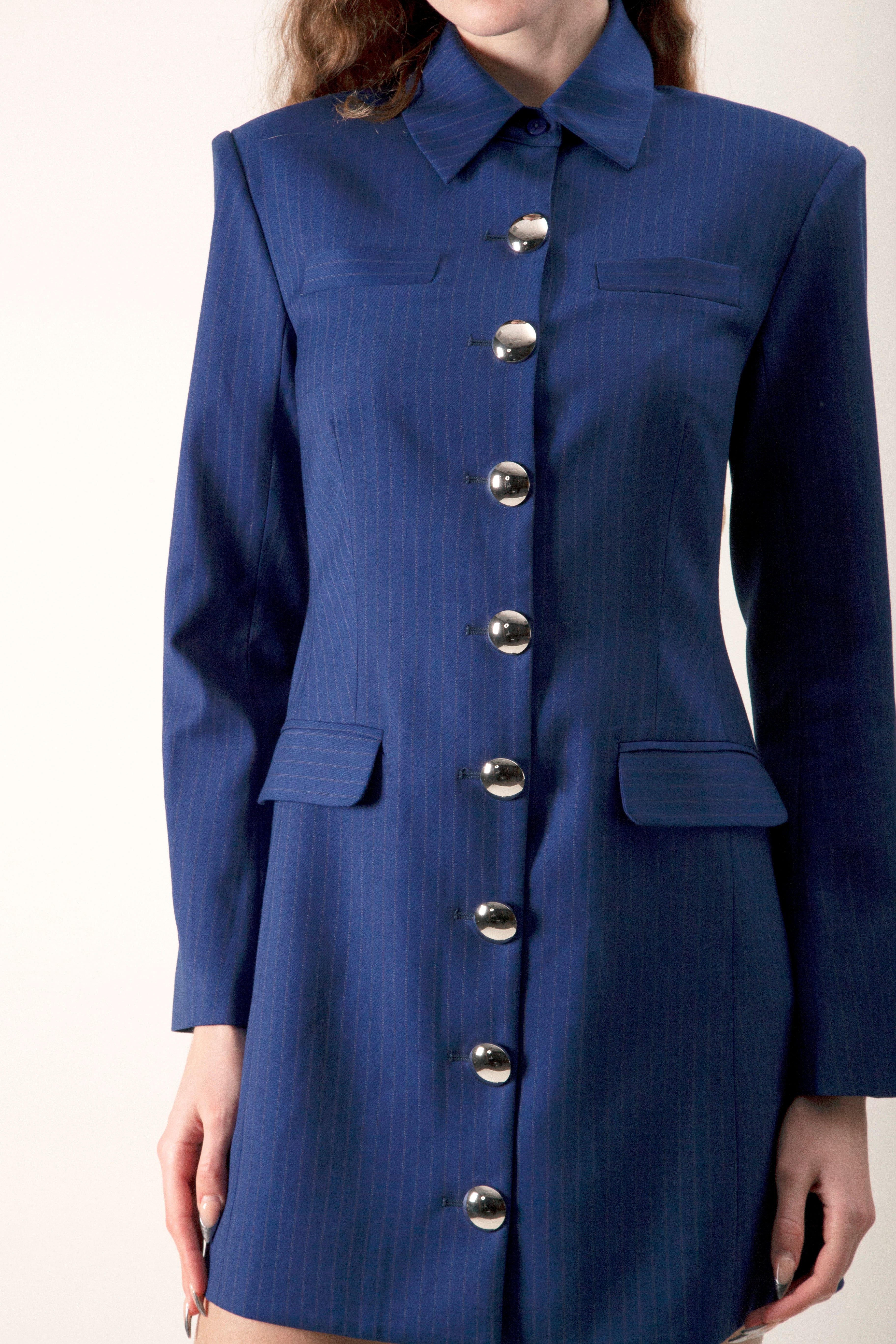 A confident expression of contemporary luxury, this dress transitions seamlessly from elevated daywear to statement evening styling.