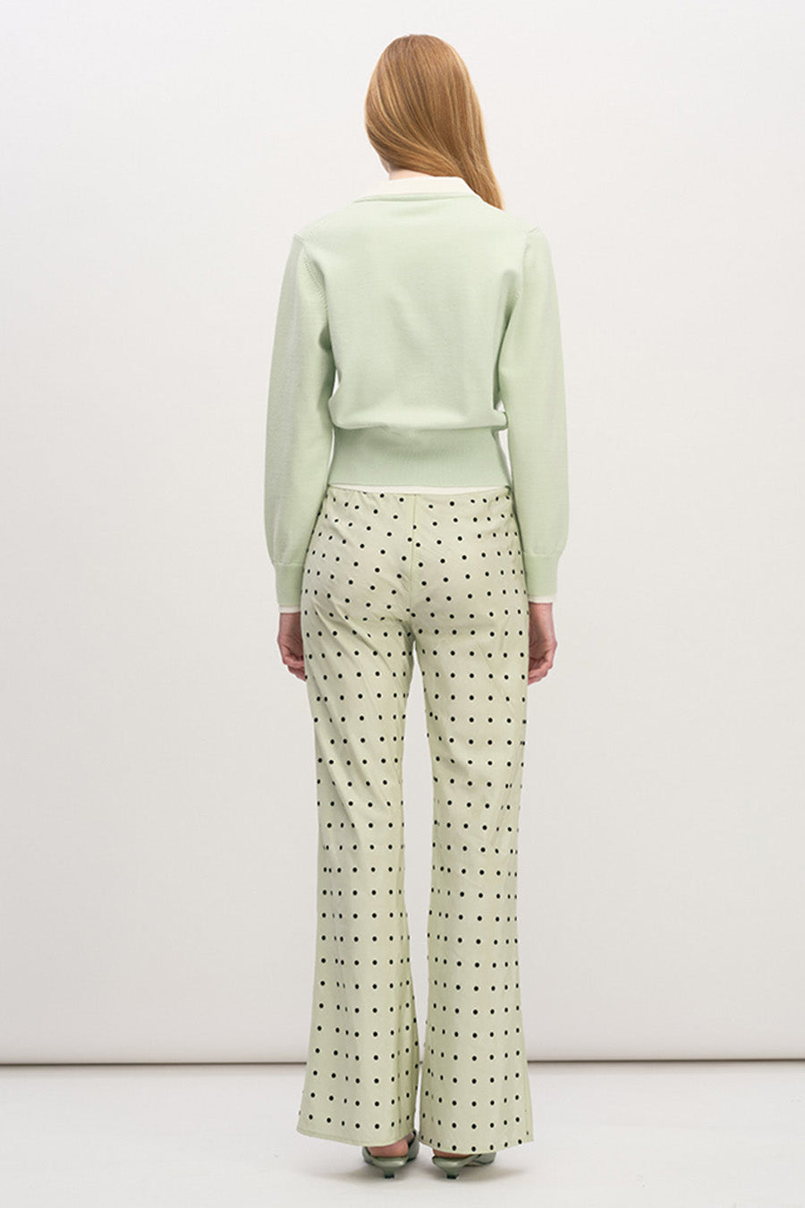 The tailored waist detail creates a flattering, softly structured silhouette, balancing femininity with modern elegance.