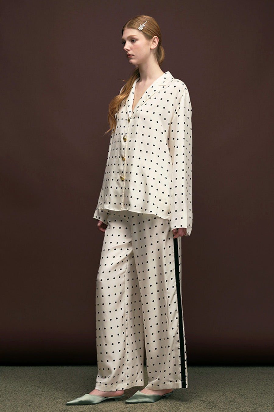 The draped lines and lightweight feel create effortless movement, making this piece a versatile luxury essential for both elevated daywear and refined evening styling.