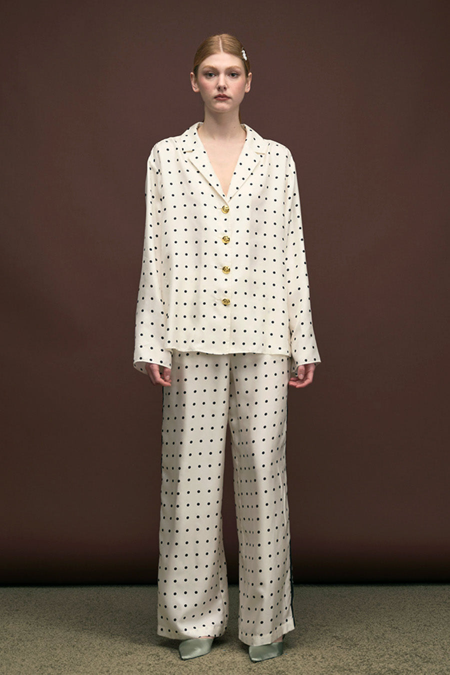 Designed with a relaxed wide-leg silhouette, they feature an elasticated waist with a delicate drawstring tie, balancing comfort with effortless elegance.