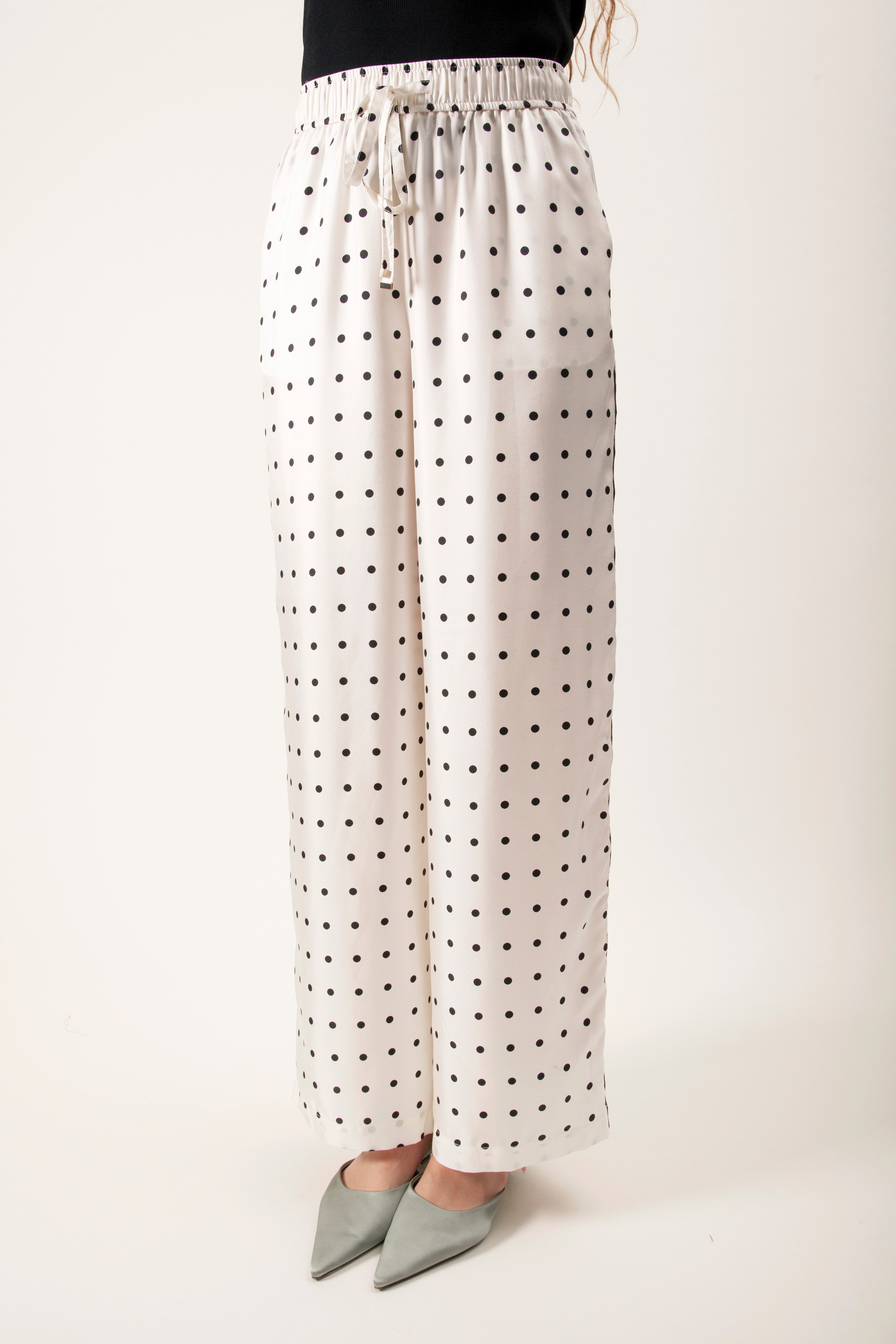 These refined trousers are crafted in a lightweight ivory fabrication, adorned with a timeless polka-dot motif for subtle graphic appeal.