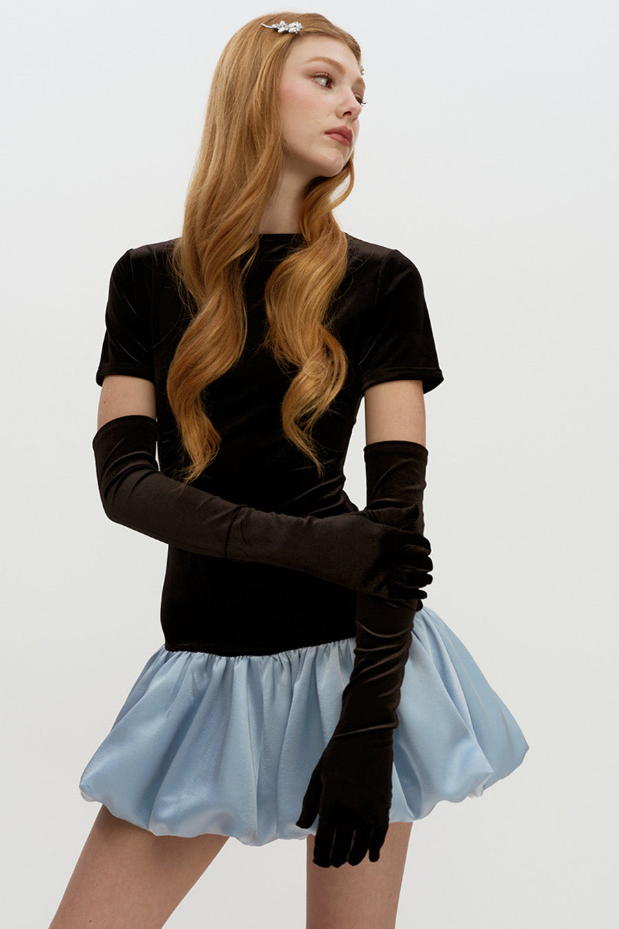 Crafted from soft velvet with a smooth finish, this dress offers a luxurious feel while maintaining comfort and structure.