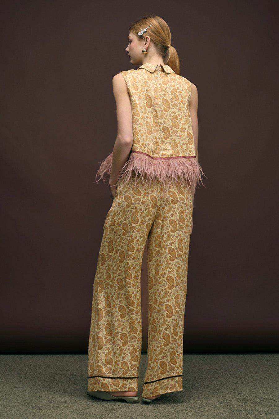 A statement of artisanal craftsmanship, this top transitions effortlessly from day to evening, pairing beautifully with tailored trousers or elevated skirts for a polished, fashion-forward look.