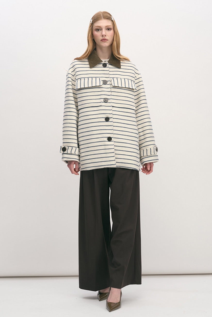Effortlessly elevated, this striped statement jacket blends timeless tailoring with modern sophistication.