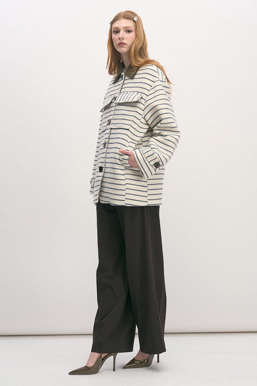 Crafted in a structured yet comfortable weave, the design features refined horizontal striping that brings understated texture and visual depth.