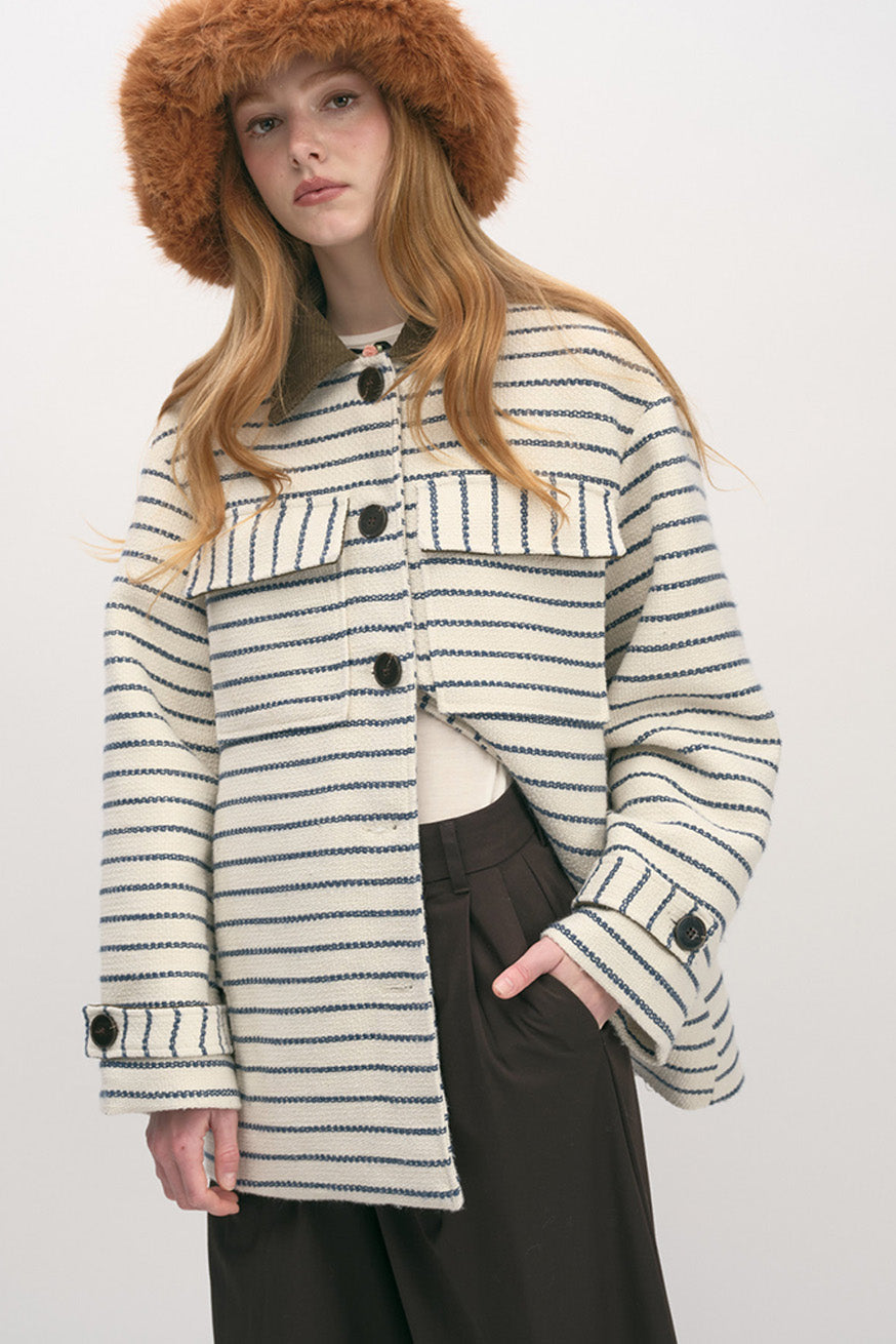 Designed for versatile layering, this jacket transitions seamlessly from city days to polished evenings.