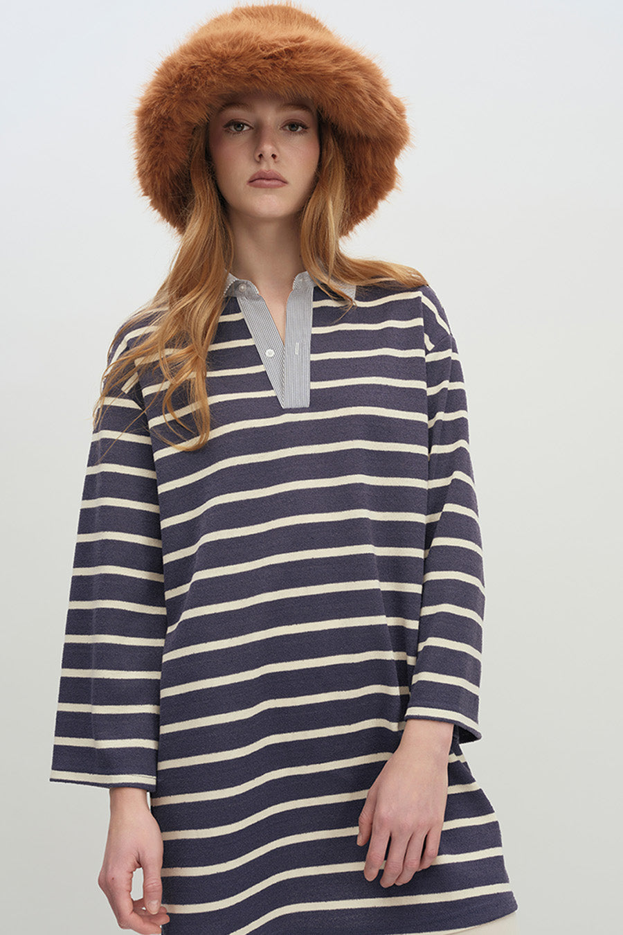 Finished with long sleeves and a straight hem, this top pairs seamlessly with trousers, leggings, or skirts for casual yet polished styling.