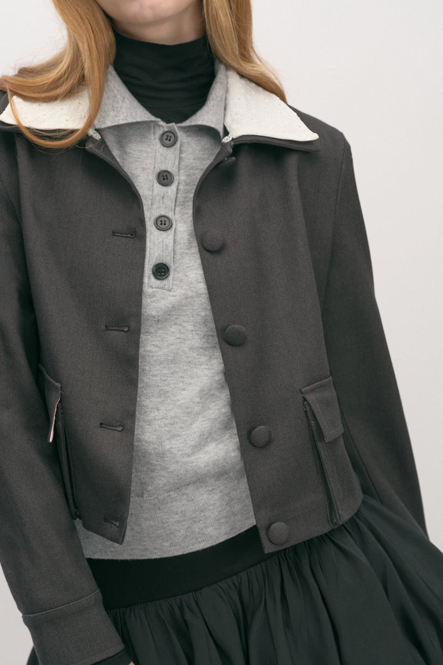 Versatile and polished, this jacket layers effortlessly over knitwear or dresses, making it a timeless statement piece for a considered wardrobe.