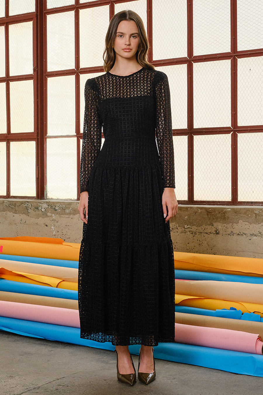 Ethereal elegance meets modern sophistication in this exquisite black lace maxi dress.