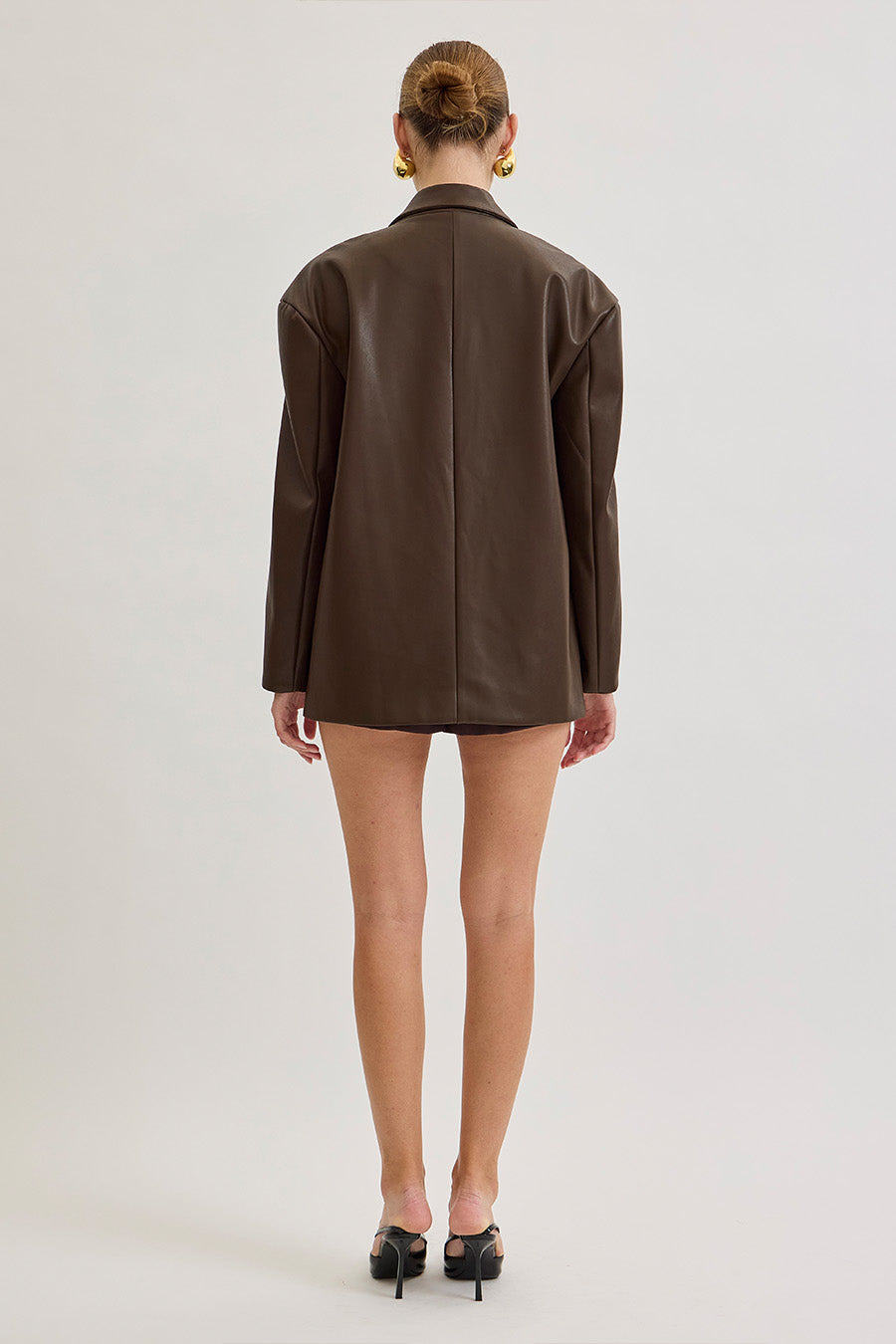 Timeless yet directional, this piece is a cornerstone of a refined luxury wardrobe.