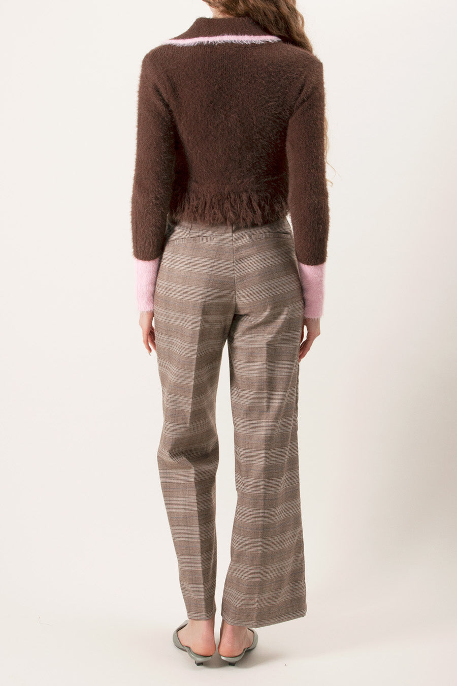 Designed with a button-front closure, contrast pink cuffs, and a coordinating collar detail, this cardigan adds visual interest while maintaining a cozy feel.