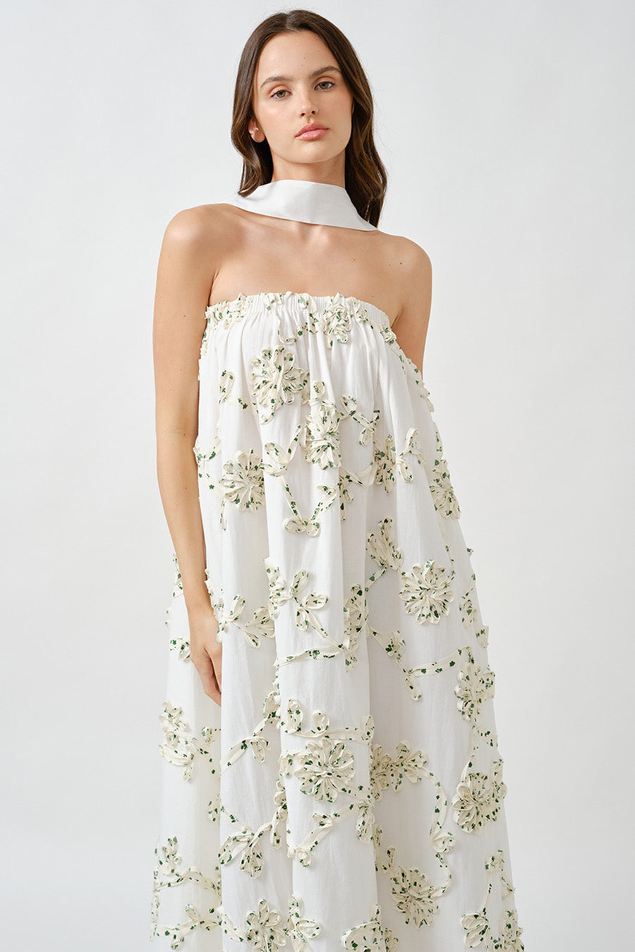 Subtle bead accents at the hem lend a final touch of refinement, making this piece ideal for destination events, garden soirées, or elevated resort occasions.