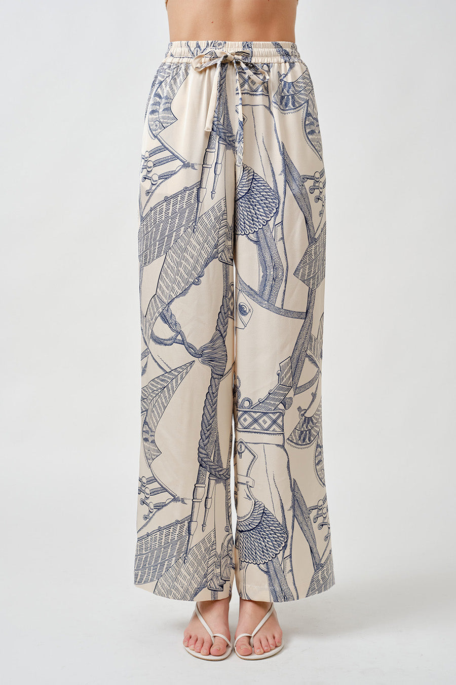 An artful expression of effortless luxury, these wide-leg pants are designed to move with grace and intention.