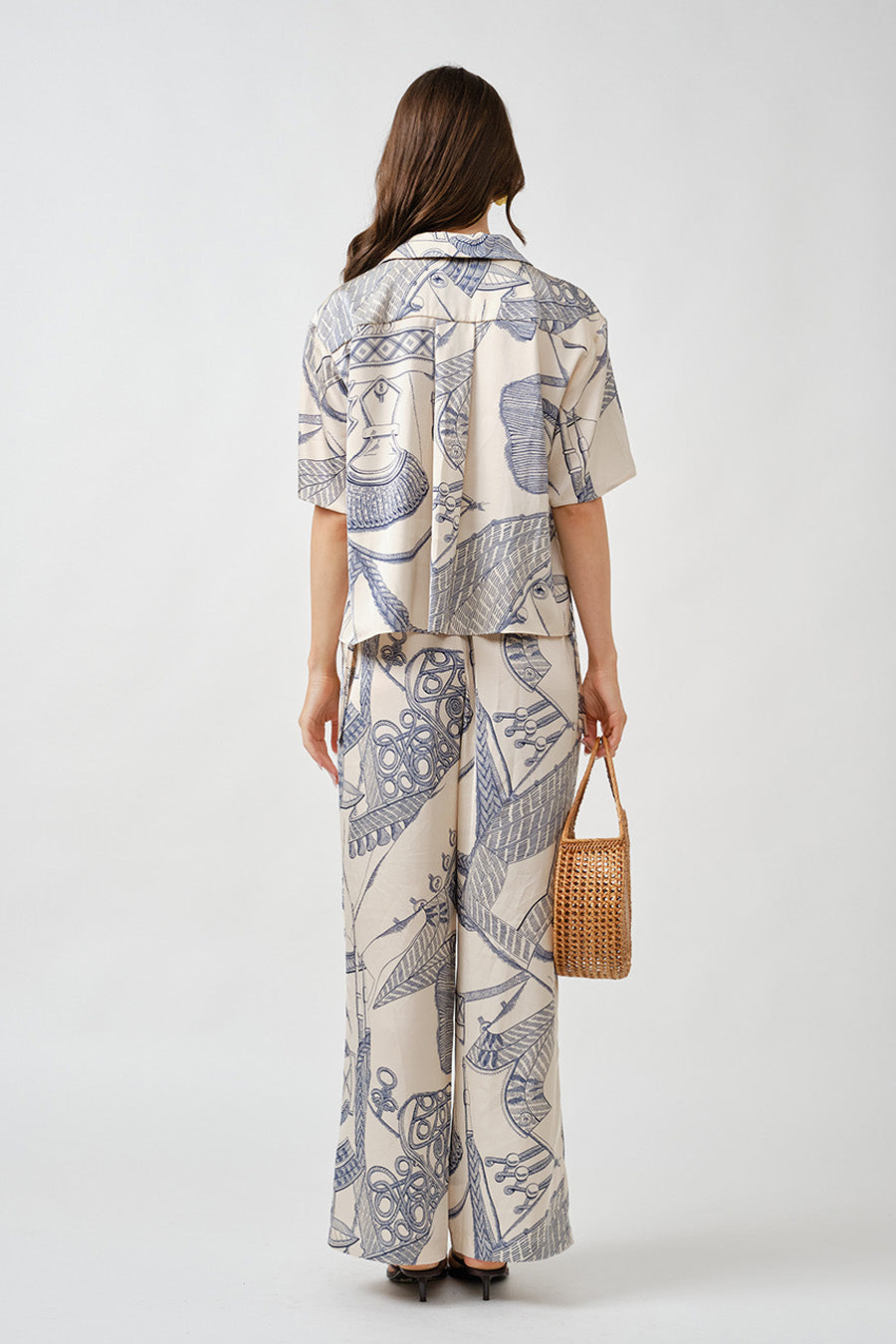 With their elongated drape and easy sophistication, these pants are ideal for elevated resort wear, city styling, or refined off-duty moments.