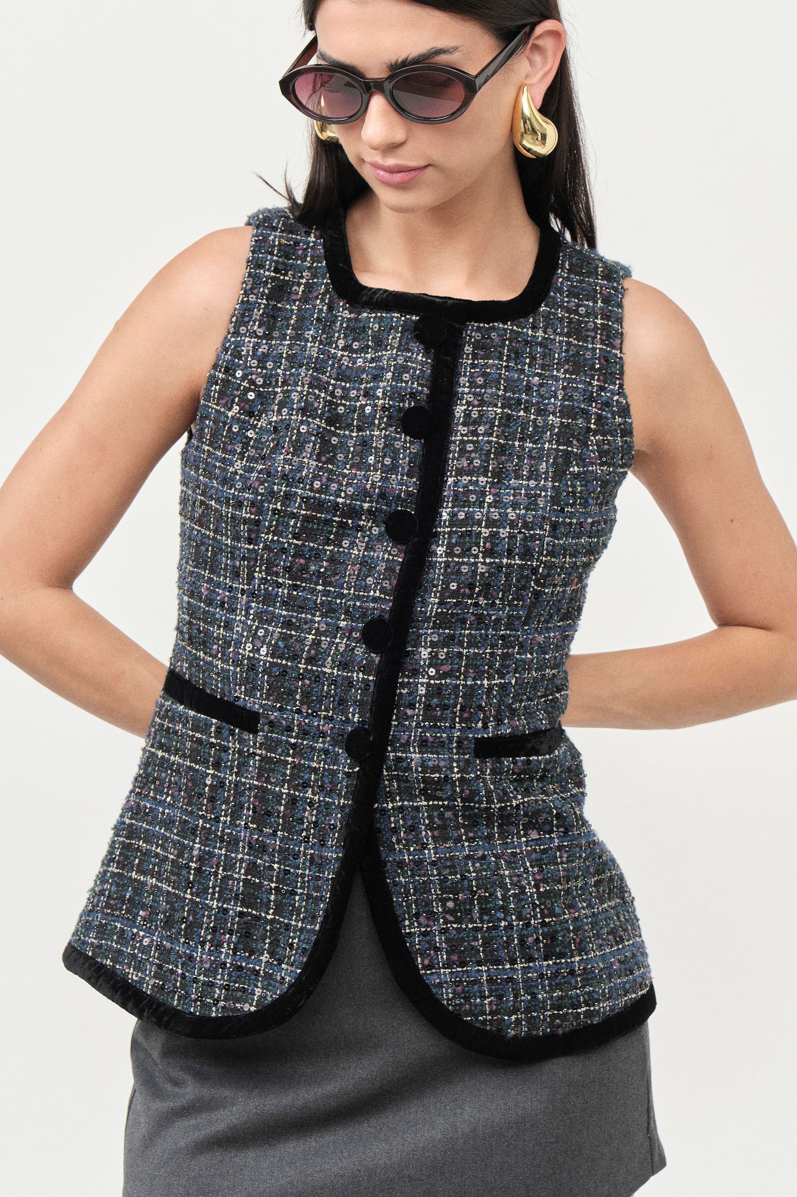 Designed to be worn alone or layered, this vest delivers timeless elegance with contemporary versatility.