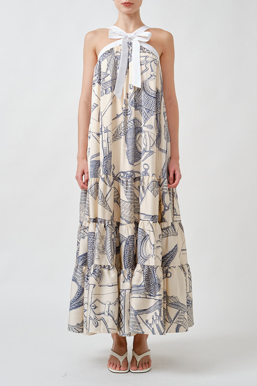 An elevated expression of effortless sophistication, this halter-neck top is designed with graceful movement and timeless allure.