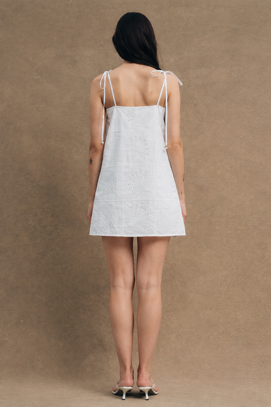 Cut from premium Italian cotton, the relaxed mini silhouette skims the body with effortless grace, falling to a flattering length that transitions seamlessly from beach to bistro