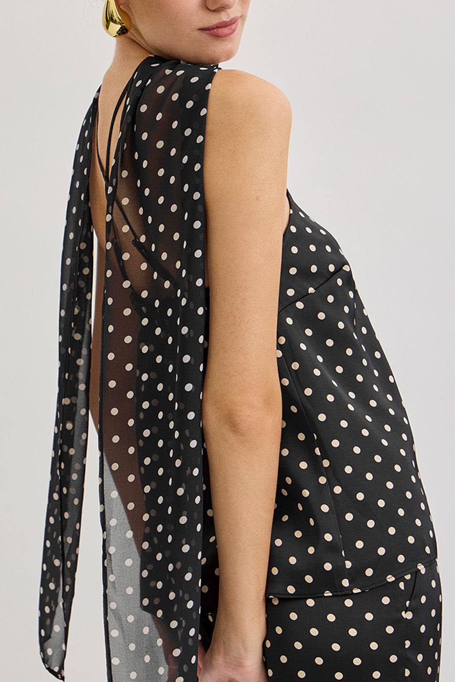 An elevated essential designed for confident, modern dressing top.