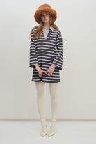 Timeless and effortlessly relaxed, this striped long-sleeve polo top is a versatile essential for everyday wear.