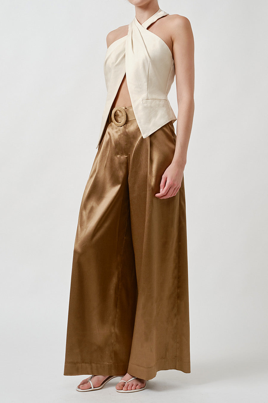 Expertly tailored to drape effortlessly across the body, the clean lines and fluid structure balance strength with femininity.