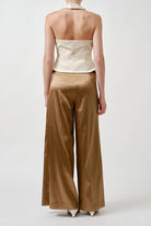 Rendered in soft ivory, this piece offers versatile sophistication—perfect for elevated daytime styling or modern evening looks.