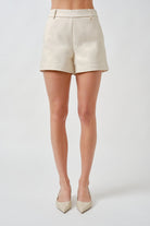 A refined essential for elevated warm-weather dressing, these tailored shorts are designed with clean lines and understated elegance.