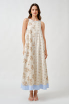 An elegant interplay of texture and pattern, this sleeveless midi dress is crafted to embody effortless sophistication.