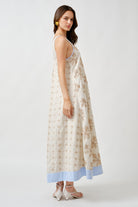 The relaxed silhouette flows gracefully over the body, offering ease without sacrificing elegance.