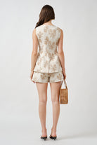 The softly structured fit and precise tailoring create a polished profile, while the ivory palette lends timeless sophistication. Effortlessly versatile, this vest transitions seamlessly from elevated daytime styling to refined evening looks.