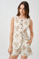 The soft ivory base and delicate pattern create a sense of quiet luxury, while the clean silhouette offers a polished, modern finish.