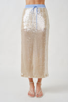 The shimmering champagne-toned sequins create a soft, luminous finish that feels refined rather than overt, making this piece both striking and versatile.