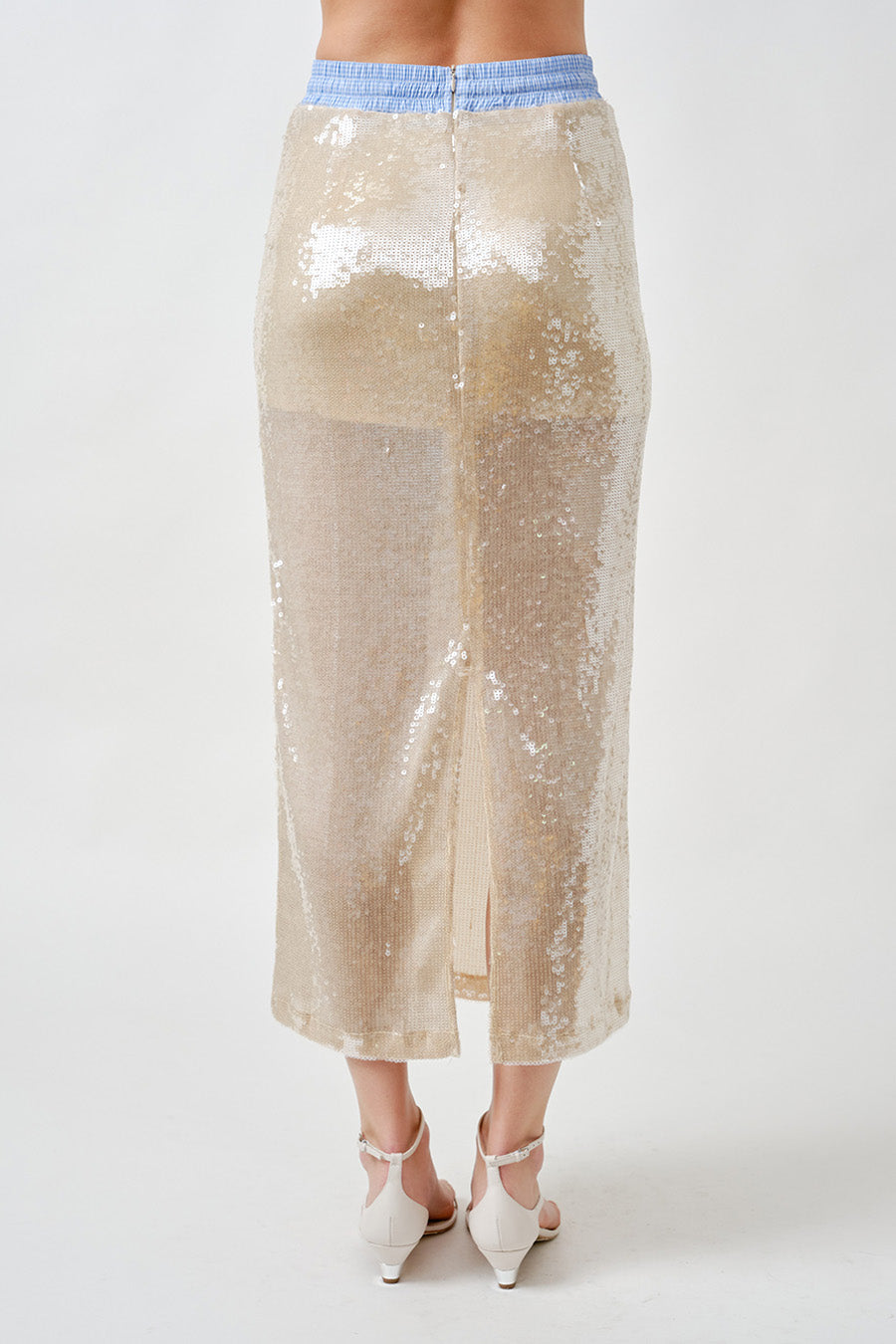 Elevated yet wearable, it transitions seamlessly from evening occasions to contemporary daytime styling when paired with tailored or textural separates.