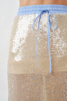 Cut in a sleek, elongated silhouette, it skims the body beautifully while allowing fluid movement with every step.