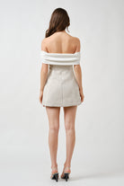 Rendered in a soft ivory hue, it offers timeless versatility—perfect for intimate celebrations, refined evenings, and elevated daytime occasions.