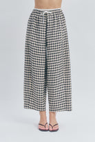 he drawstring waist ensures comfort without sacrificing polish, while side pockets add practical functionality