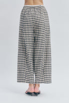 Woven from a luxurious Italian linen-cotton blend, the cropped length hits precisely at the ankle,