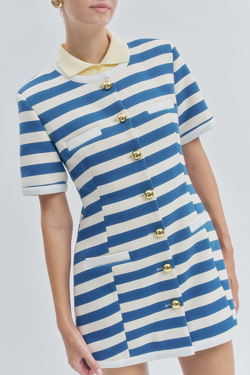 The timeless blue-and-ivory stripe pattern delivers a fresh, Parisian-inspired aesthetic—perfect for workdays, city strolls, and elevated casual occasions.