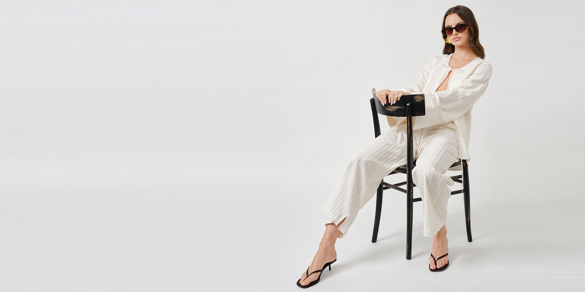 Ivory jacket and pants set on the chair banner